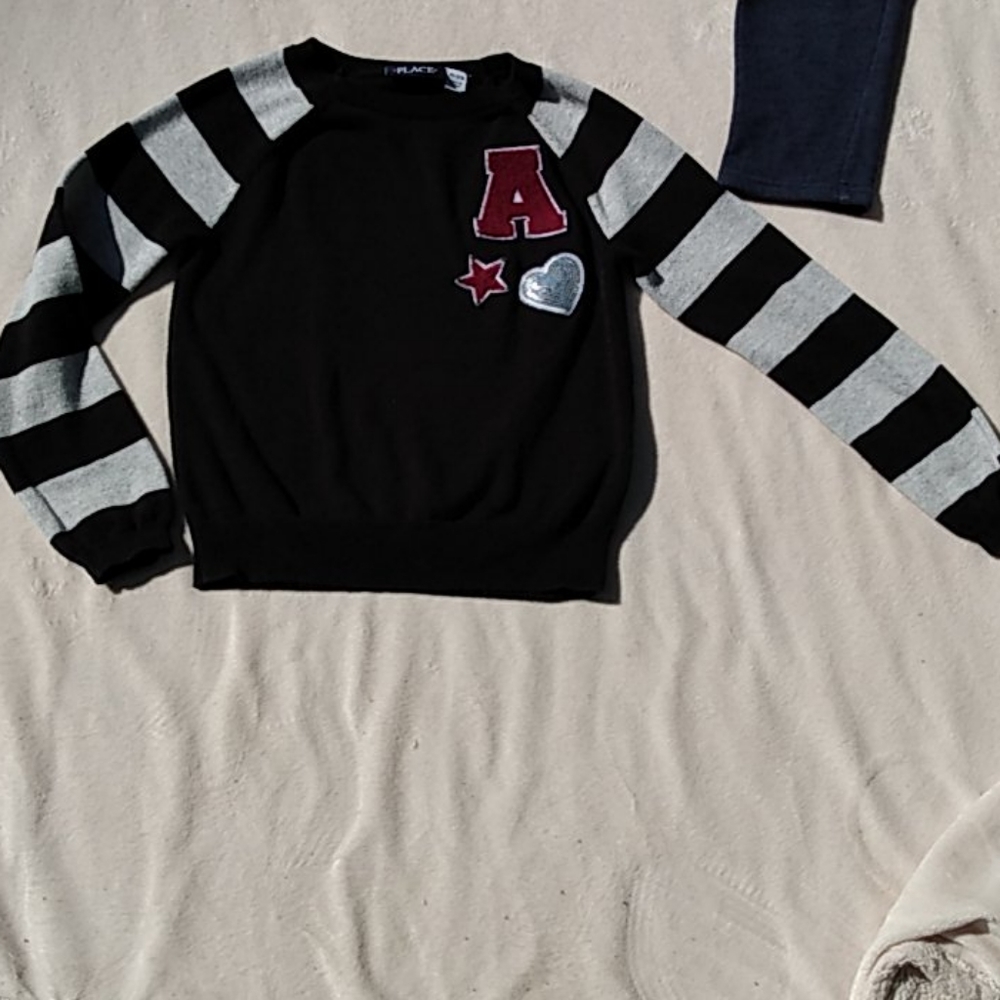 Black and gray varsity sweater